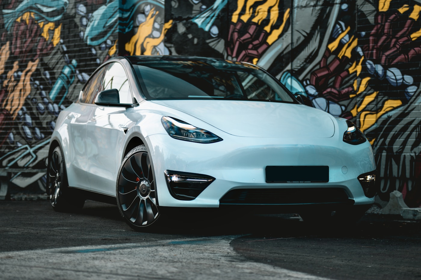Tesla Model Y receiving paint protection film and ceramic window tint
